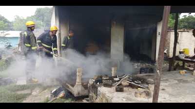 A house set on fire by enraged locals after the killings in Kaushambi on Friday. (HT Photo) A house set on fire by enraged locals after the killings in Kaushambi on Friday. (HT Photo)