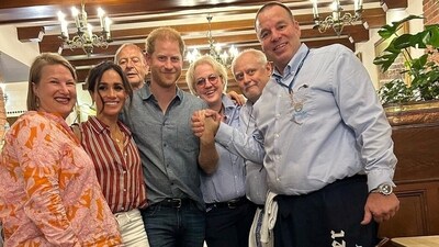 Britain's Prince Harry and Meghan, Duchess of Sussex, pose for a picture as they visit a pub in Dusseldorf, Germany, September 14, 2023 in this picture obtained from social media. Schumacher Altbier-Manufaktur, Dusseldorf/via REUTERS (via REUTERS)