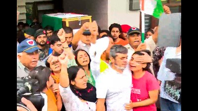 Family members and relatives mourn near the mortal remains of Major Aashish Dhonchak before his last rites at his native place in Panipat on Friday.Thousands of people gathered to console the grieving family members, including his wife Jyoti and his mother, on his final journey. Aashish’s three-year-old daughter also paid floral tributes to her father. (PTI) Family members and relatives mourn near the mortal remains of Major Aashish Dhonchak before his last rites at his native place in Panipat on Friday.Thousands of people gathered to console the grieving family members, including his wife Jyoti and his mother, on his final journey. Aashish’s three-year-old daughter also paid floral tributes to her father. (PTI)