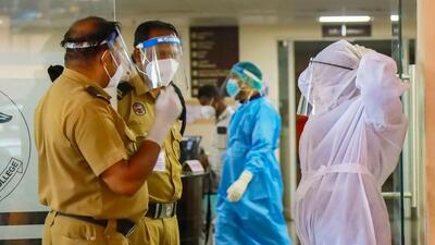 Health workers and security personnel control entry at an emergency ward at the medical college amid an outbreak of Nipah virus in Kerala in Kozhikode on Friday. (PTI)