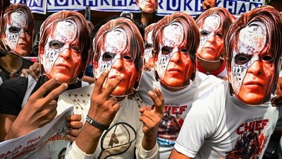 Fans of actor Shah Rukh Khan wear his masks from the newly-released movie Jawan. (PTI) Fans of actor Shah Rukh Khan wear his masks from the newly-released movie Jawan. (PTI)