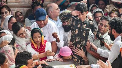 Kabir, 7, the son of Colonel Manpreet Singh salutes his father as family members mourn near his mortal remains before the last rites at his native Bharaunjian village in Mohali on Friday. Colonel Singh made the supreme sacrifice on Wednesday in an encounter with terrorists in Jammu and Kashmir’s Anantnag district. (PTI Photo) Kabir, 7, the son of Colonel Manpreet Singh salutes his father as family members mourn near his mortal remains before the last rites at his native Bharaunjian village in Mohali on Friday. Colonel Singh made the supreme sacrifice on Wednesday in an encounter with terrorists in Jammu and Kashmir’s Anantnag district. (PTI Photo)