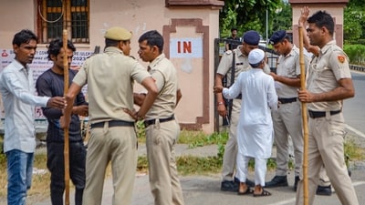 Police personnel deployed outside a court where arrested Congress MLA Mamman Khan will be produced in connection with the Nuh violence case, in Nuh district, Friday, Sept. 15. (PTI) Police personnel deployed outside a court where arrested Congress MLA Mamman Khan will be produced in connection with the Nuh violence case, in Nuh district, Friday, Sept. 15. (PTI)