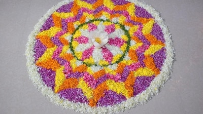 Simple Flower Design: For a floral design, begin by creating a small circular or square base, then draw a large flower in the center using a combination of petals and circles, surround the flower with leaves and smaller flowers, and finally, use bright green, yellow, and orange colors to give it a vibrant look. (Unsplash) Simple Flower Design: For a floral design, begin by creating a small circular or square base, then draw a large flower in the center using a combination of petals and circles, surround the flower with leaves and smaller flowers, and finally, use bright green, yellow, and orange colors to give it a vibrant look. (Unsplash)