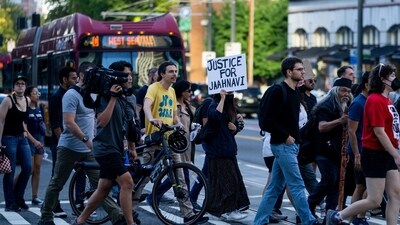 Protesters march through downtown Seattle after body camera footage was released of a Seattle police officer joking about the death of Jaahnavi Kandula. (AP)