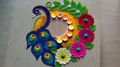 Peacock Design: To create a peacock design, start by drawing a peacock in the center of your rangoli, adding feathers, eyes, and a beak to the peacock. Then, decorate the surrounding area with simple flower and leaf patterns, using shades of green, blue, and purple for the peacock. (Pinterest) Peacock Design: To create a peacock design, start by drawing a peacock in the center of your rangoli, adding feathers, eyes, and a beak to the peacock. Then, decorate the surrounding area with simple flower and leaf patterns, using shades of green, blue, and purple for the peacock. (Pinterest)