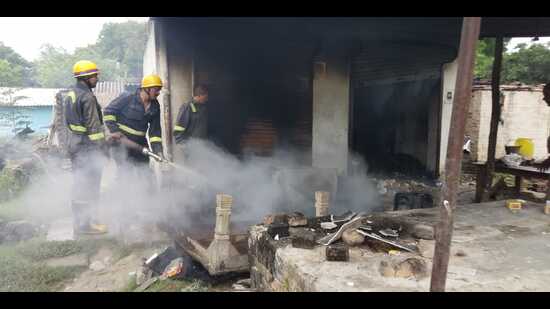A house set on fire by enraged locals after the killings in Kaushambi on Friday. (HT Photo)