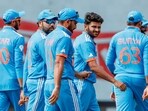 India's skipper Rohit Sharma with Shardul Thakur and others
