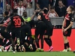 Bayer Leverkusen's Argentine midfielder #25 Exequiel Palacios celebrates scoring the 2-2 goal with his team-mates
