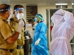 Health workers and security personnel control entry at an emergency ward at the medical college amid an outbreak of Nipah virus in Kerala in Kozhikode. (PTI)