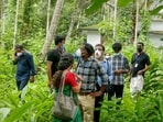 Health workers collect clinical samples and investigate the home of a Nipah virus victim, in Kozhikode on Friday. (PTI)