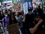 Protesters march through downtown Seattle after body camera footage was released of a Seattle police officer joking about the death of Jaahnavi Kandula.