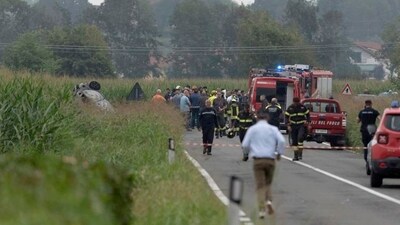 Emergency personnel work on the scene where a jet of aerobatic demonstration team of the Italian Air Force the "Frecce Tricolori" (Tricolor Arrows) crashed during an exercise (Reuters)