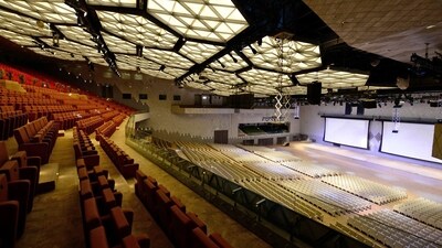 The Convention Center spans over 73 thousand square meters and includes 15 convention rooms, such as the main Auditorium, the Grand Ballroom, and 13 meeting rooms. It has a collective capacity to accommodate 11,000 delegates. Notably, the Convention Center boasts the largest LED media facade in the country. (ANI) The Convention Center spans over 73 thousand square meters and includes 15 convention rooms, such as the main Auditorium, the Grand Ballroom, and 13 meeting rooms. It has a collective capacity to accommodate 11,000 delegates. Notably, the Convention Center boasts the largest LED media facade in the country. (ANI)
