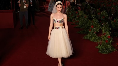 Maude Apatow walked the Vogue World red carpet in a creation from Bode's spring 2024 collection. She wore a full tulle skirt and a cropped bra top, both embellished with a beaded floral pattern. A veil, deep red lip shade, and high heels rounded it off.&nbsp; (REUTERS)