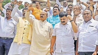 Former Karnataka chief minister Basavaraj Bommai with BJP MLAs stage a protest. (ANI) Former Karnataka chief minister Basavaraj Bommai with BJP MLAs stage a protest. (ANI)