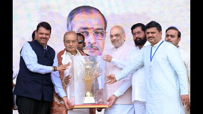 Navi Mumbai, Apr 16 (ANI): Union Home Minister Amit Shah with Maharashtra Chief Minister Eknath Shinde and State Deputy CM Devendra Fadnavis felicitates the 'Maharashtra Bhushan Award' to social worker Dattatreya Narayan Dharmadhikari alias Appasaheb Dharmadhikari during a ceremony, in Navi Mumbai on Sunday. (ANI Photo) (Amit Shah Twitter) Navi Mumbai, Apr 16 (ANI): Union Home Minister Amit Shah with Maharashtra Chief Minister Eknath Shinde and State Deputy CM Devendra Fadnavis felicitates the 'Maharashtra Bhushan Award' to social worker Dattatreya Narayan Dharmadhikari alias Appasaheb Dharmadhikari during a ceremony, in Navi Mumbai on Sunday. (ANI Photo) (Amit Shah Twitter)