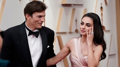 FILE - Ashton Kutcher, left, and Mila Kunis arrive at the Oscars on March 27, 2022, at the Dolby Theatre in Los Angeles. The couple are apologizing for character letters they wrote on behalf of fellow “That ’70s Show” actor Danny Masterson before he was sentenced for rape this week.  (AP Photo/Jae C. Hong, File) (Jae C. Hong/Invision/AP)