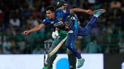 Maheesh Theekshana dives to stop a ball (AP)