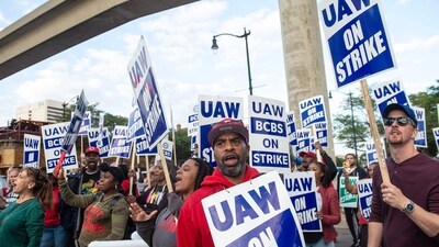 Blue Cross Blue Shield employees show their support to members of the United Auto Workers (UAW) union as they march through the streets of downtown Detroit following a rally on the first day of the UAW strike in Detroit, Michigan, on September 15, 2023. (AFP) Blue Cross Blue Shield employees show their support to members of the United Auto Workers (UAW) union as they march through the streets of downtown Detroit following a rally on the first day of the UAW strike in Detroit, Michigan, on September 15, 2023. (AFP)
