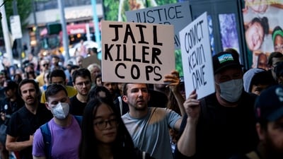 Protesters march through downtown Seattle after body camera footage was released of a Seattle police officer joking about the death of Jaahnavi Kandula. (AP) Protesters march through downtown Seattle after body camera footage was released of a Seattle police officer joking about the death of Jaahnavi Kandula. (AP)