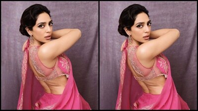 Her saree is a stunning statement piece made from a luxurious blend of silk organza and cotton silk. It is embellished with exquisite hand embroidery, dori embroidery and hand adda work. Its soft pink hue makes it an ideal choice for special occasions. (Instagram/@sobhitad) Her saree is a stunning statement piece made from a luxurious blend of silk organza and cotton silk. It is embellished with exquisite hand embroidery, dori embroidery and hand adda work. Its soft pink hue makes it an ideal choice for special occasions. (Instagram/@sobhitad)