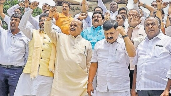 Former Karnataka chief minister Basavaraj Bommai with BJP MLAs stage a protest. (ANI)