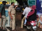 Police and health officials manning a road checkpoint let residents enter a containment zone following an increase of Nipah virus cases in Cheruvannur village of Kozhikode district in Kerala on September 16, 2023.
