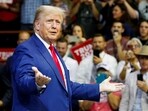 FILE PHOTO: Former U.S. President and Republican presidential candidate Donald Trump speaks on the stage at a South Dakota Republican party rally in Rapid City,