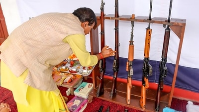 A priest worships the weapons of Gopeshwar Police on the occasion of Vishwakarma Puja in Chamoli district of Uttarakhand. (ANI) A priest worships the weapons of Gopeshwar Police on the occasion of Vishwakarma Puja in Chamoli district of Uttarakhand. (ANI)