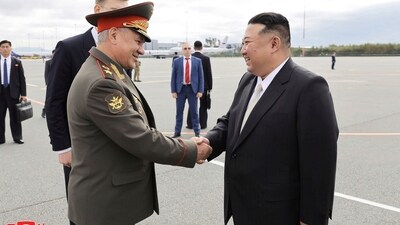 North Korean leader Kim Jong Un, right, is greeted by Russian Defense Minister Sergei Shoigu. (AP)