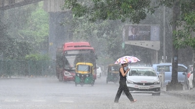 Commuters seen during heavy rains at Panchkuian Road in New Delhi. (Photo by Sanchit Khanna/ Hindustan Times) Commuters seen during heavy rains at Panchkuian Road in New Delhi. (Photo by Sanchit Khanna/ Hindustan Times)
