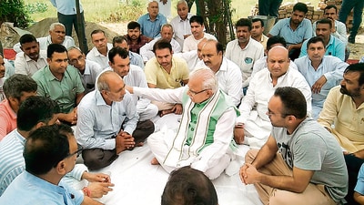 Haryana chief minister Manhor Lal Khattar with the family members of Major Aashish Dhonchak in Panipat on Sunday. (HT Photo) Haryana chief minister Manhor Lal Khattar with the family members of Major Aashish Dhonchak in Panipat on Sunday. (HT Photo)