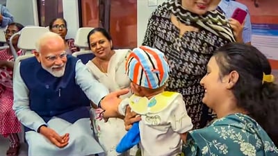 During the ride, many passengers interacted with PM Modi and snapped selfies with him. (PTI) During the ride, many passengers interacted with PM Modi and snapped selfies with him. (PTI)