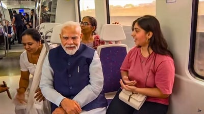 Prime Minister Narendra Modi on Sunday inaugurated the nearly two-km extension of the Delhi Airport Metro Express line from Dwarka Sector 21 to a new metro station ‘YashoBhoomi Dwarka Sector 25.' After the inauguration, he took a ride on the Delhi Metro. (PTI) Prime Minister Narendra Modi on Sunday inaugurated the nearly two-km extension of the Delhi Airport Metro Express line from Dwarka Sector 21 to a new metro station ‘YashoBhoomi Dwarka Sector 25.' After the inauguration, he took a ride on the Delhi Metro. (PTI)