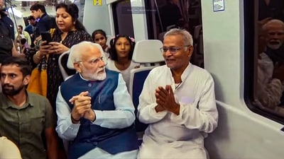Visuals showed PM Modi interacting with the passengers inside the Metro, who also took selfies and wished him a happy birthday. (PTI) Visuals showed PM Modi interacting with the passengers inside the Metro, who also took selfies and wished him a happy birthday. (PTI)