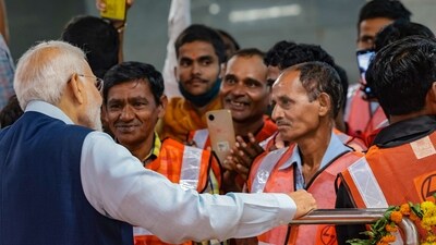 Prime Minister Narendra Modi interacts with employees of the Delhi Metro after inaugurating the extension of the Delhi Airport Metro Express line (PTI) Prime Minister Narendra Modi interacts with employees of the Delhi Metro after inaugurating the extension of the Delhi Airport Metro Express line (PTI)