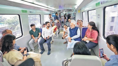 Prime Minister Narendra Modi boarded a train from the Dhaula Kuan Metro station and interacted with passengers onboard, and posed for selfies. (HT Photo) Prime Minister Narendra Modi boarded a train from the Dhaula Kuan Metro station and interacted with passengers onboard, and posed for selfies. (HT Photo)