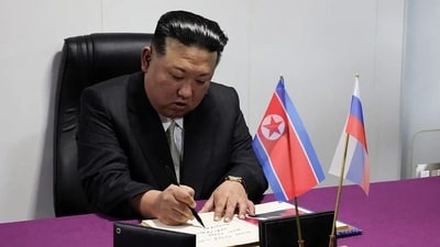 North Korea's leader Kim Jong Un signs a guest book. (AFP) North Korea's leader Kim Jong Un signs a guest book. (AFP)