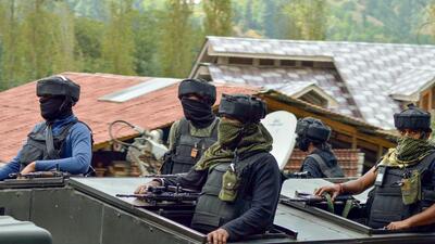 Security personnel on the fifth day of the ongoing encounter with terrorists, at Gadol Kokarnag in Anantnag district, Sunday. (PTI)
