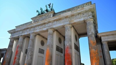 Climate Protests: The columns of Berlin's landmark the Brandenburg Gate are covered in orange paint. (AFP)