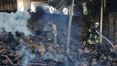 Russia-Ukraine War: Firefighters work to extinguish fire at a warehouse destroyed in shelling in the course of Russia-Ukraine conflict in Donetsk. (Reuters)