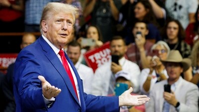 FILE PHOTO: Former U.S. President and Republican presidential candidate Donald Trump speaks on the stage at a South Dakota Republican party rally in Rapid City, (REUTERS)
