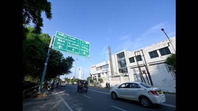 Udyog Marg is home to many automobile outlets and offices of multinational companies, but the illegal parking on both pavements and roadsides has turned this wide road into a narrow bottleneck. (Sunil Ghosh/HT Photo) Udyog Marg is home to many automobile outlets and offices of multinational companies, but the illegal parking on both pavements and roadsides has turned this wide road into a narrow bottleneck. (Sunil Ghosh/HT Photo)