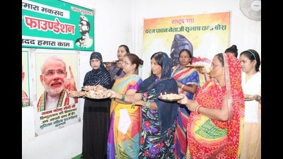 Women celebrate birthday of Prime Minister Narendra Modi in Varanasi on Sunday. (HT Photo) Women celebrate birthday of Prime Minister Narendra Modi in Varanasi on Sunday. (HT Photo)