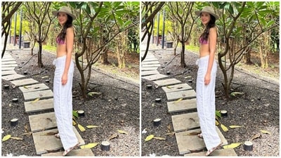 For her comfortable and casual look, Shanaya chose a light pink bikini top featuring a halter neckline and a tie detail at the back. She teamed it with white cotton flared trousers. (Instagram/@shanayakapoor02) For her comfortable and casual look, Shanaya chose a light pink bikini top featuring a halter neckline and a tie detail at the back. She teamed it with white cotton flared trousers. (Instagram/@shanayakapoor02)