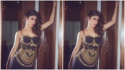 Mouni played muse to fashion designer Rocky Star and picked a black slip dress with embellishments from the shelves of the designer. (Instagram/@imouniroy) Mouni played muse to fashion designer Rocky Star and picked a black slip dress with embellishments from the shelves of the designer. (Instagram/@imouniroy)