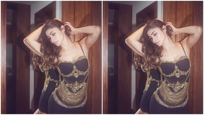 Mouni looked like a billion bucks in the black slip dress featuring bodycon details. The attire hugged her shape and showed off her curves perfectly. The actor added the right amount of bling to her look with golden embellishments adorning the dress. (Instagram/@imouniroy) Mouni looked like a billion bucks in the black slip dress featuring bodycon details. The attire hugged her shape and showed off her curves perfectly. The actor added the right amount of bling to her look with golden embellishments adorning the dress. (Instagram/@imouniroy)