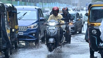 People crossing a Road in a Heavy Monsoon Rain (Photo by Vijay Bate/HT Photo) People crossing a Road in a Heavy Monsoon Rain (Photo by Vijay Bate/HT Photo)
