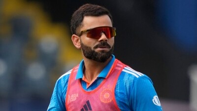 Virat Kohli attends playing members during a break in the Asia Cup cricket match between Bangladesh and India in Colombo. (AP) Virat Kohli attends playing members during a break in the Asia Cup cricket match between Bangladesh and India in Colombo. (AP)
